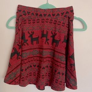 Brand Rue21. Color red w/ black & grey details (Christmas themed). Size small